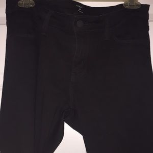 Ruffle hemmed black jeans